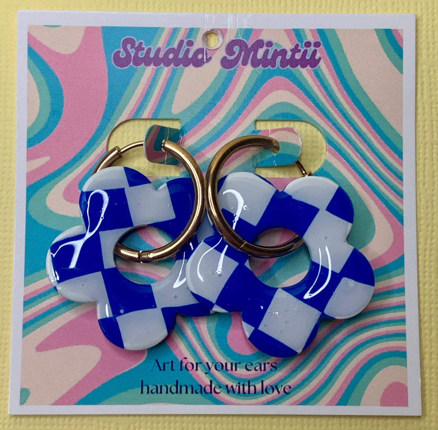 White and Blue Checkerboard Flower Hoops - Studio Mintii Add a touch of fun to your wardrobe with our White and Blue Checkerboard Flower Hoops! These playful polymer clay hoops feature a charming checkerboard pattern in white and blue, perfect for adding a pop of colour to any outfit. Stay stylish and lighthearted with these unique statement earrings!  #