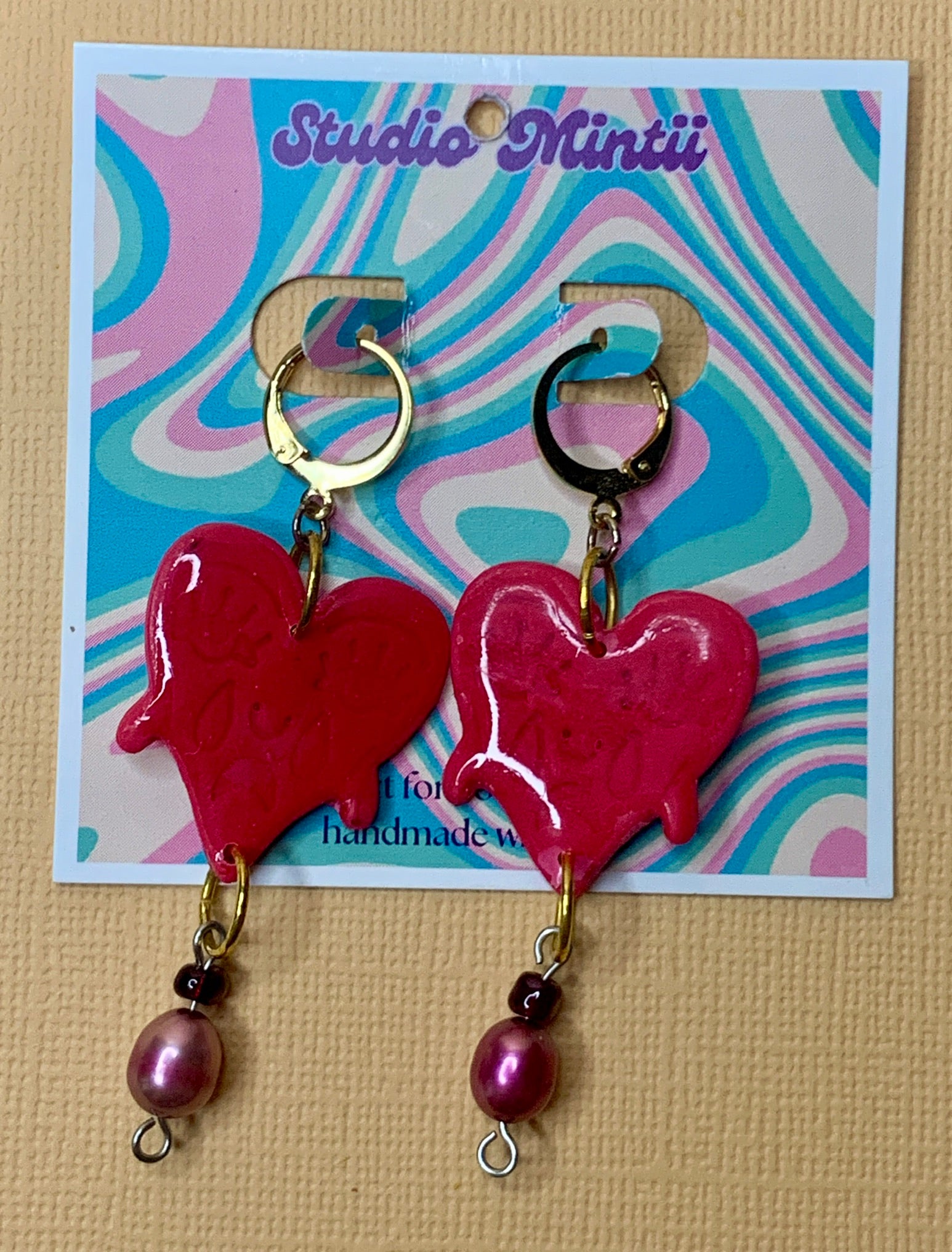 Crying Heart Dangles - Studio Mintii These Crying Heart Dangles will tug at your heartstrings (and earlobes). The red glass, and pearl beads add a touch of elegance to these quirky and playful earrings.  #