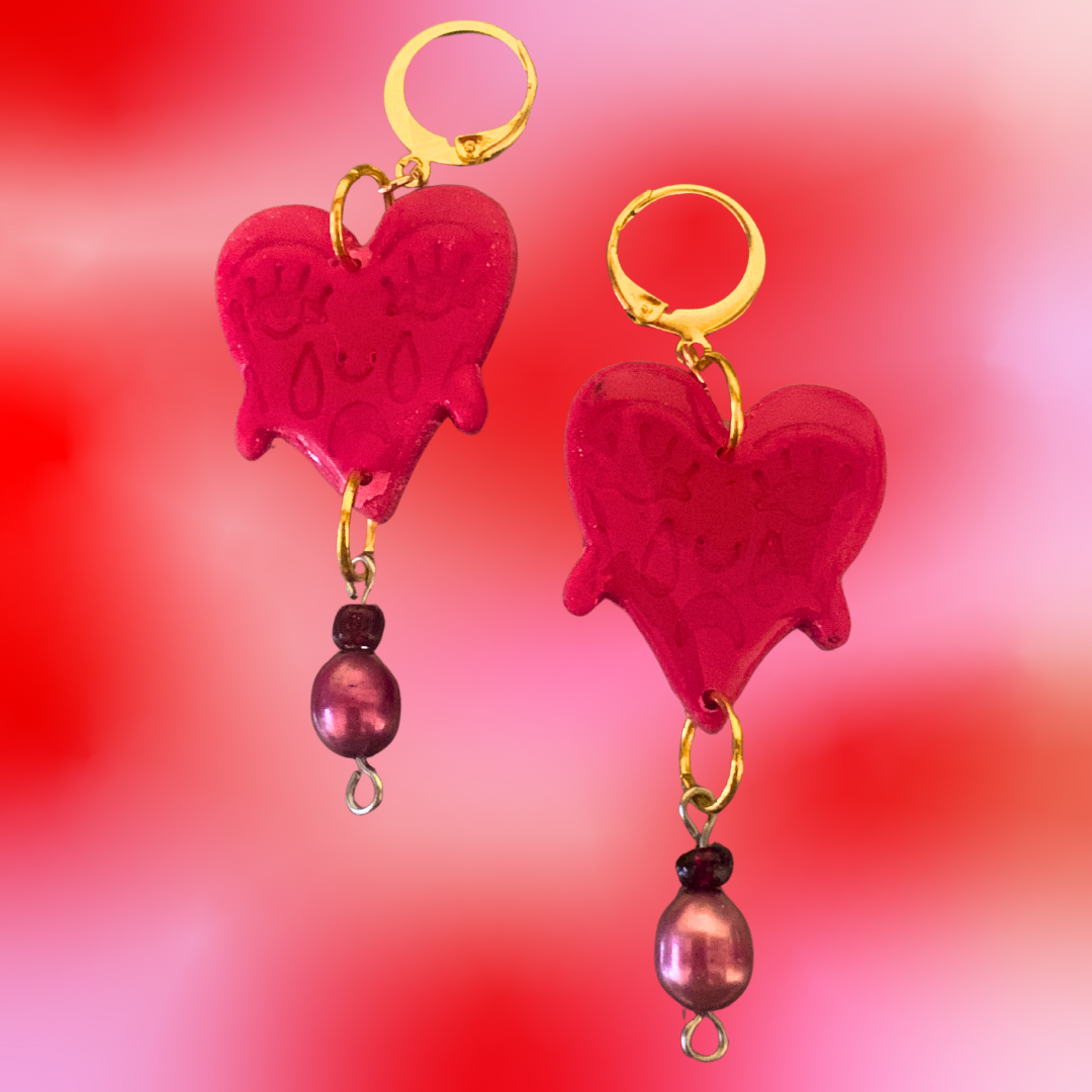 Crying Heart Dangles - Studio Mintii These Crying Heart Dangles will tug at your heartstrings (and earlobes). The red glass, and pearl beads add a touch of elegance to these quirky and playful earrings.  #