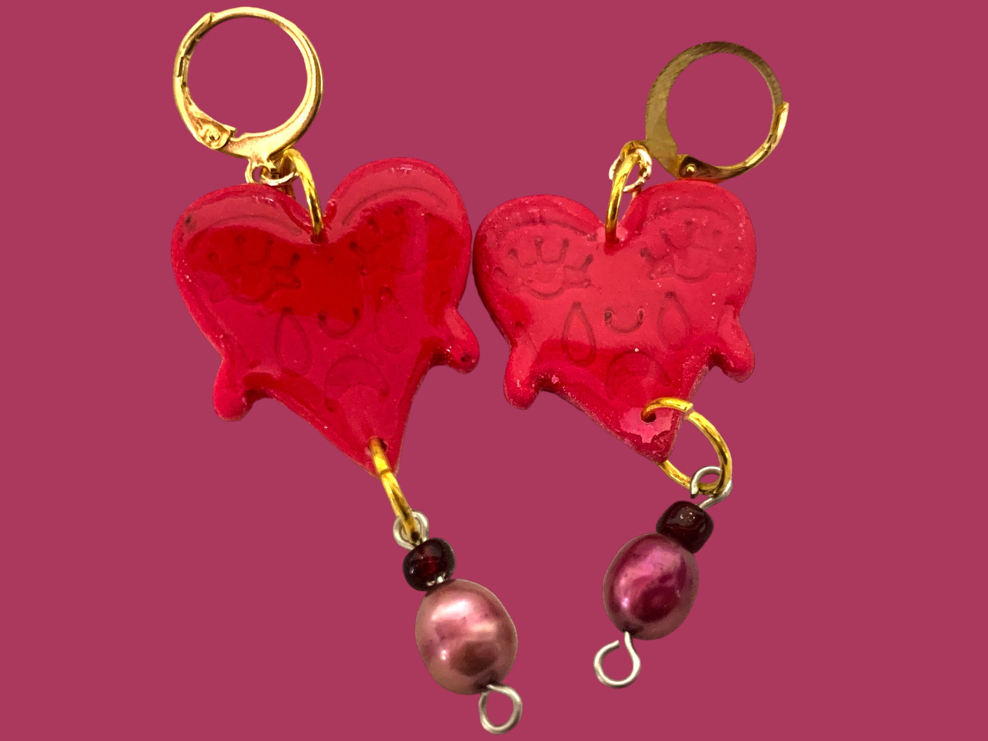 Crying Heart Dangles - Studio Mintii These Crying Heart Dangles will tug at your heartstrings (and earlobes). The red glass, and pearl beads add a touch of elegance to these quirky and playful earrings.  #